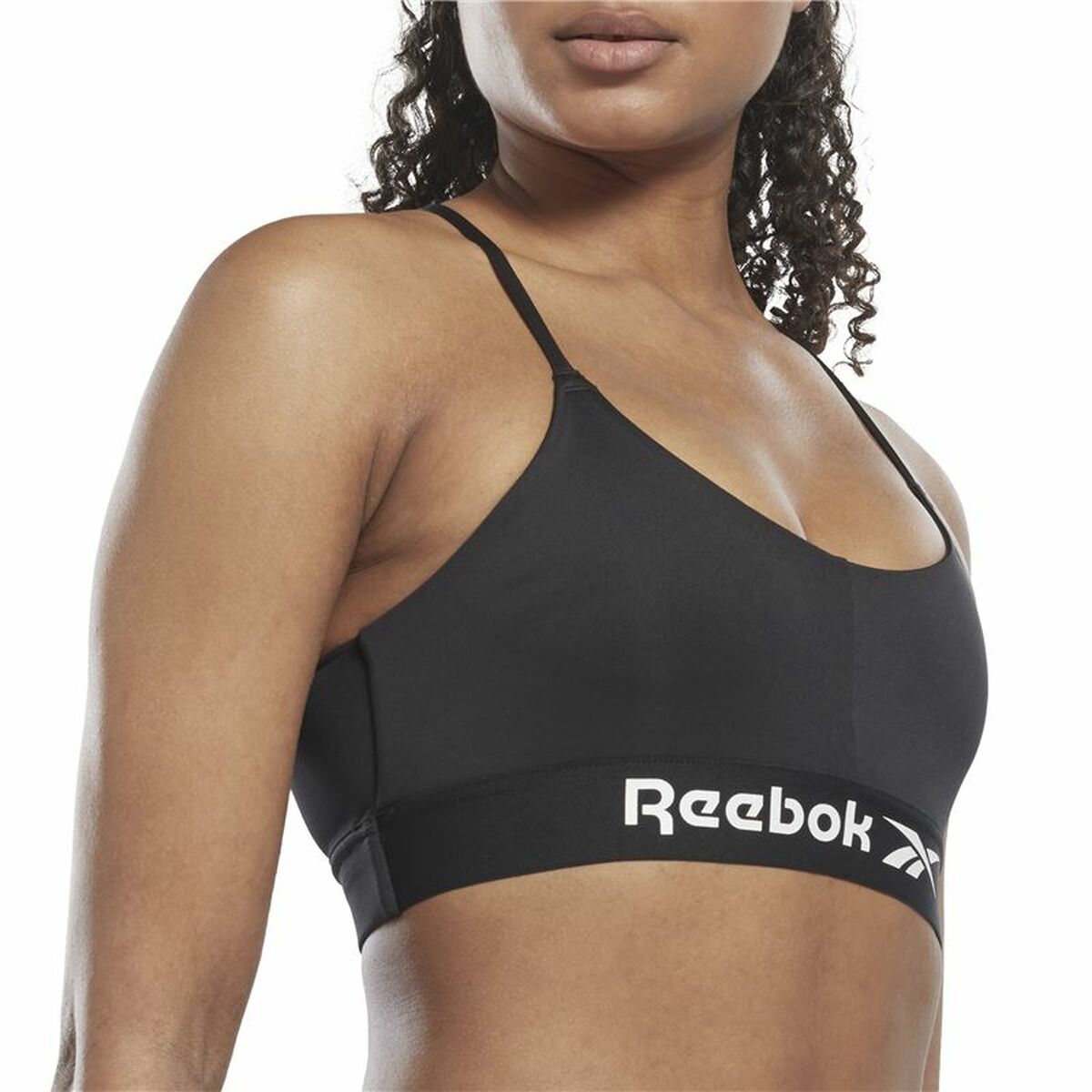 "Närbild fram på Reebok Workout Ready svart sport-bh – Speedwick-material och stödjande resår."