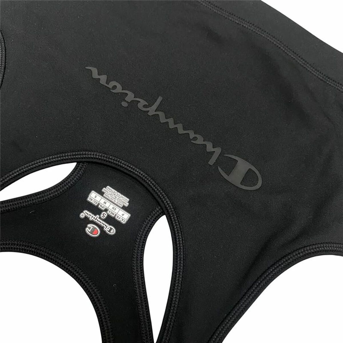 "Champion Fitness Bra sport-bh svart – närbild på materialets struktur och logga."