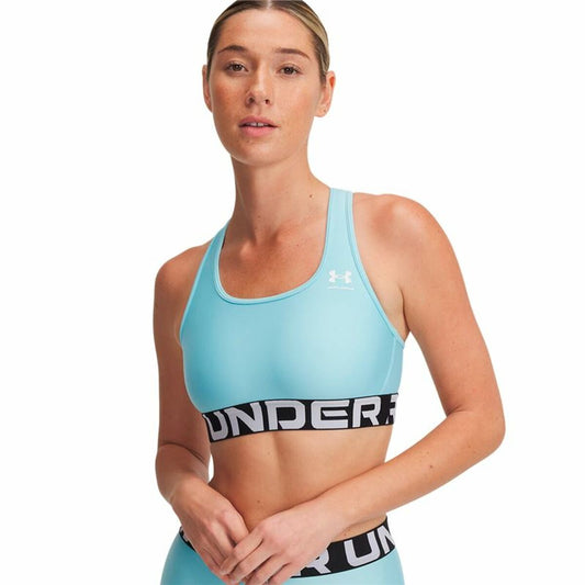 "Under Armour HG Mid Branded sport-bh dam vatten – medelhögt stöd och HeatGear-material."