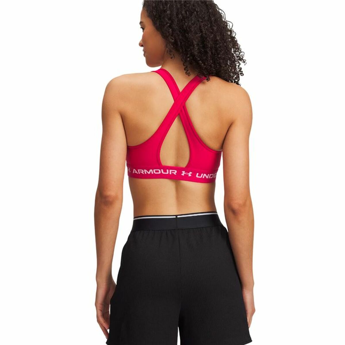 "Under Armour Crossback Mid sport-bh rosa – baksida med korsad design för stabilitet och rörelsefrihet."