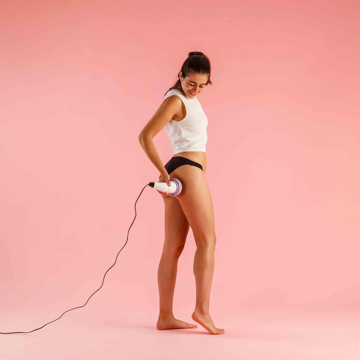 "Solac ME7714 anticellulit-enhet i hand vid användning"